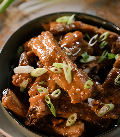 Pork back ribs cooked in a slow cooker with an orange sesame sauce. Serve individual ribs as a appetizer.