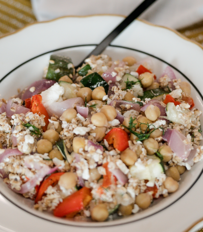 Colourful roasted vegetables, chickpeas and steel cut oats are layered in glass jars for a beautiful presentation and easy, packable lunch.